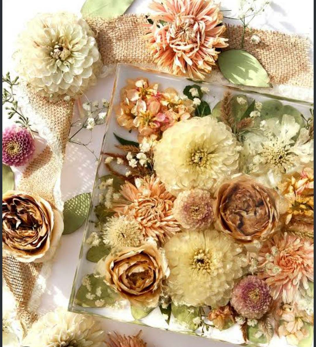 Square resin keepsake filled with cream, peach, and green dried flowers